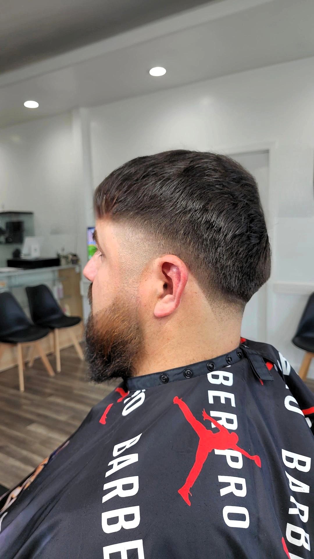 Professional barbershop haircut showcasing detail work